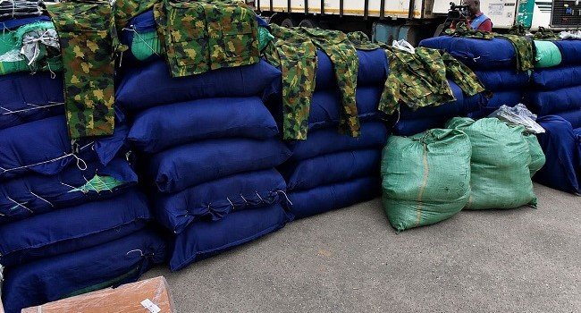 Police intercept 47 sacks of military uniforms, arrest suspects Police intercept 47 sacks of military uniforms, arrest suspects